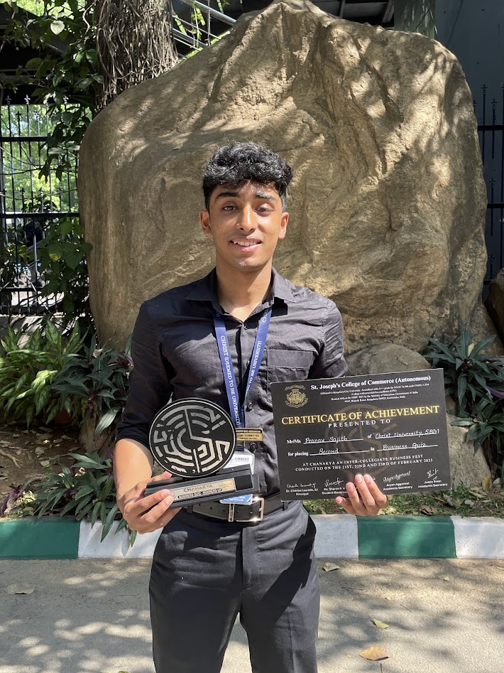Pranav with the Chanakya Business Quiz runner-up trophy and certificate