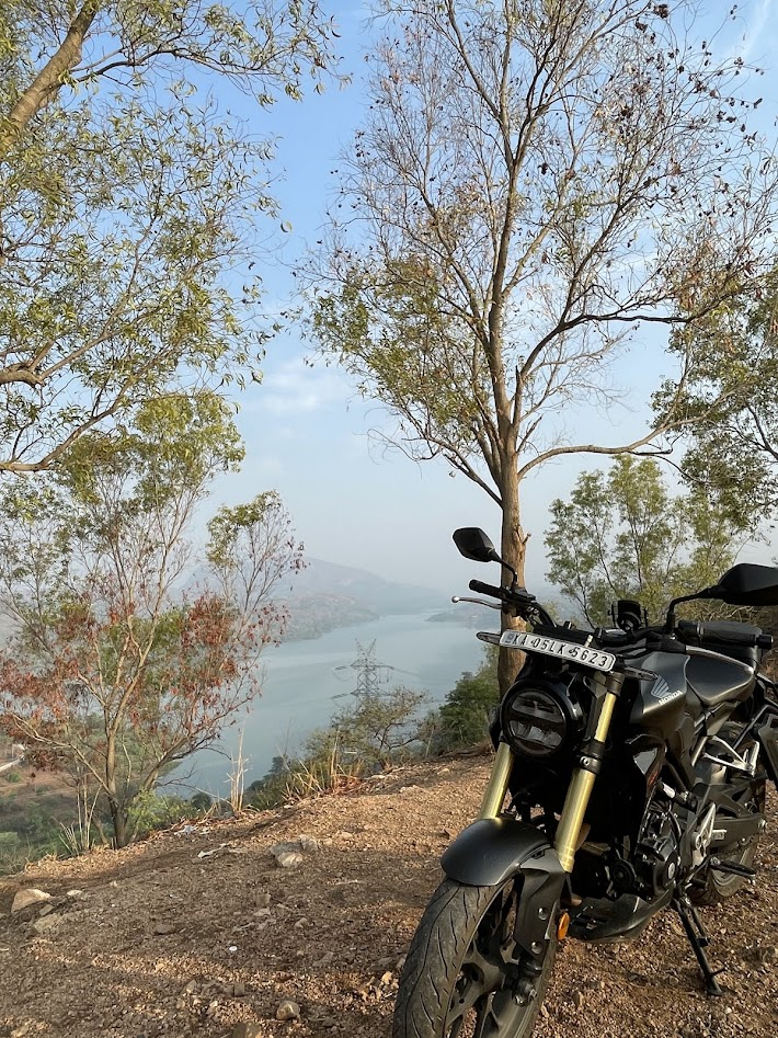 Honda CB300R parked on a hilltop overlooking a lake south of Bengaluru